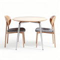 Table ronde en bois de 90 cm avec chaises en tissu gris et pieds métalliques